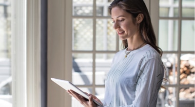 Woman in a tablet at home